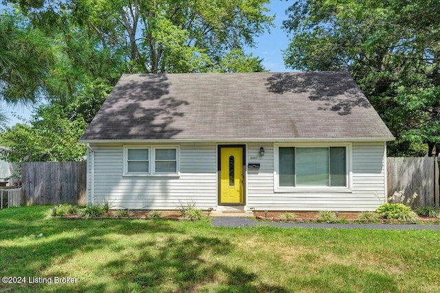 cape cod home with a front yard