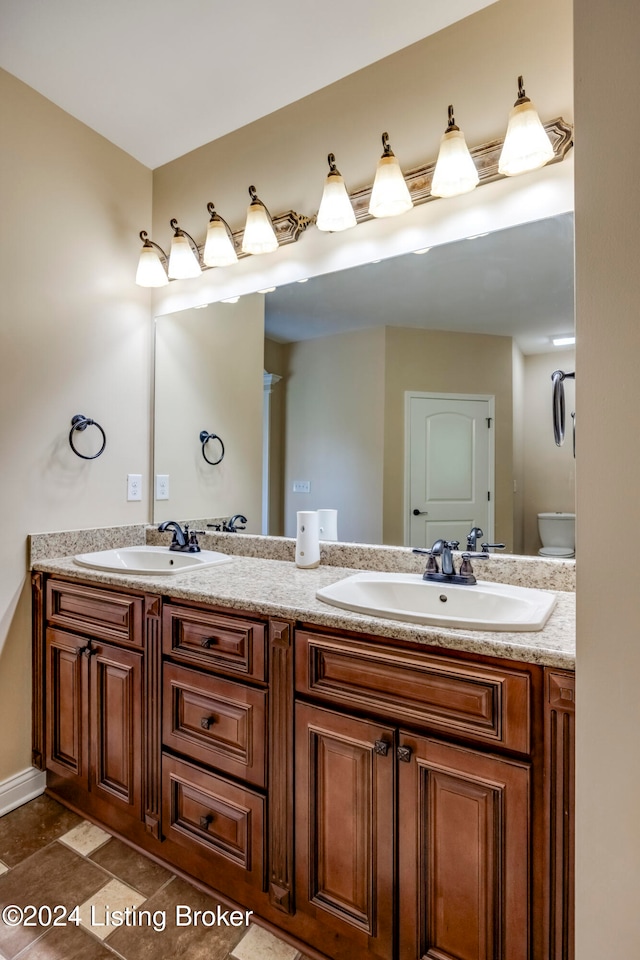 bathroom with vanity and toilet