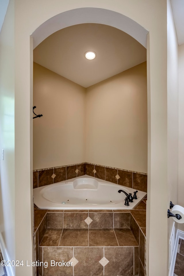 bathroom with tiled bath