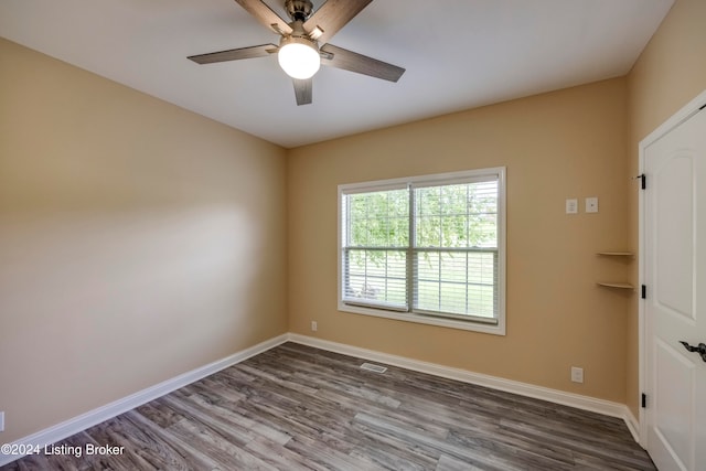 unfurnished room with hardwood / wood-style floors and ceiling fan