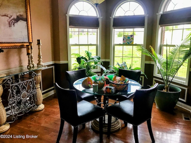 dining room with dark wood-type flooring