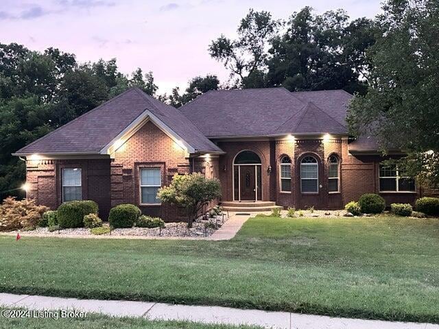 view of front of house with a yard