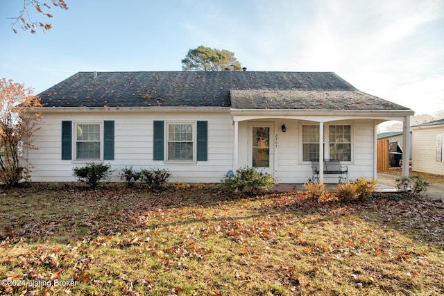 view of front of home with a front lawn and a porch