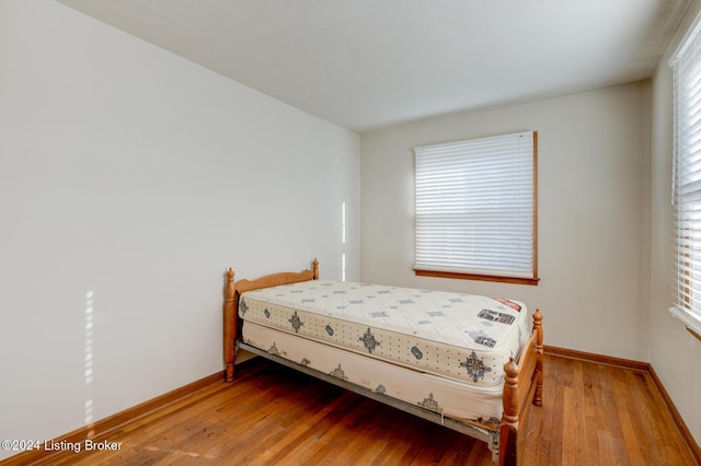 bedroom featuring hardwood / wood-style flooring