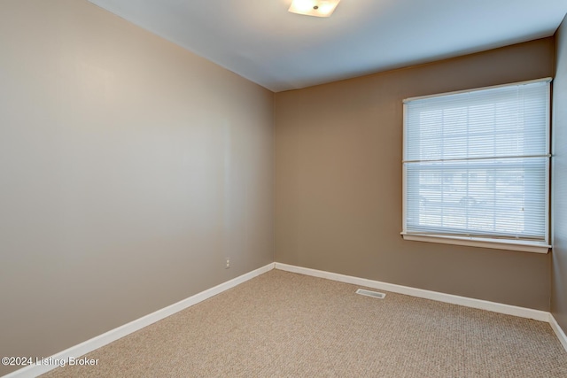 spare room featuring carpet floors