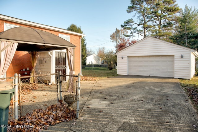 view of side of property with a garage and an outdoor structure