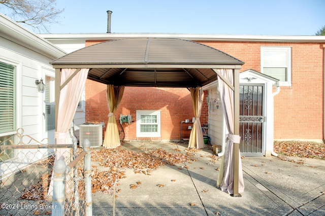 view of patio with a gazebo and cooling unit