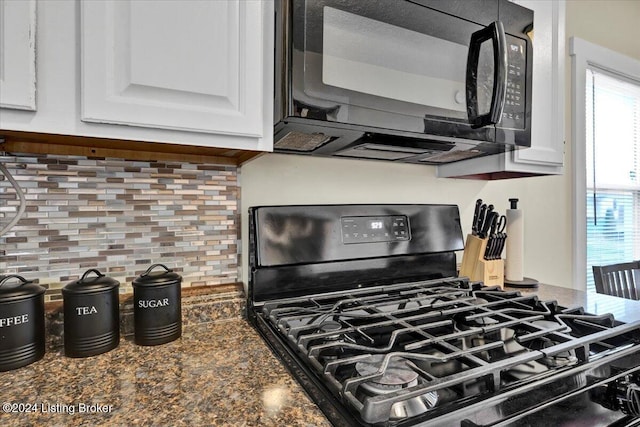 kitchen with white cabinetry, a wealth of natural light, tasteful backsplash, and black appliances