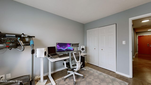 office area with hardwood / wood-style floors