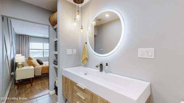 bathroom featuring hardwood / wood-style floors, vanity, and toilet