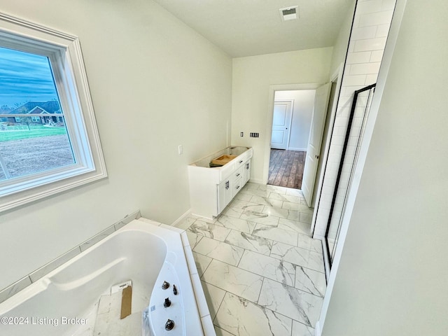 bathroom featuring separate shower and tub, vanity, and wood-type flooring