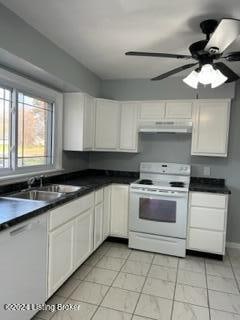 kitchen featuring ceiling fan, white cabinetry, white electric range, and sink