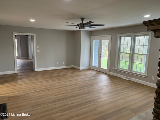 unfurnished room featuring ceiling fan and light hardwood / wood-style floors