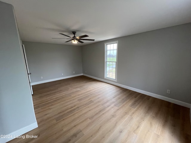 spare room featuring ceiling fan and light wood-type flooring