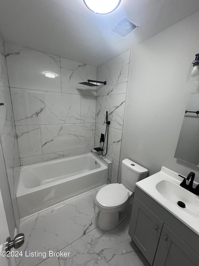 full bathroom with vanity, tiled shower / bath combo, and toilet