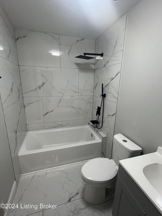 full bathroom featuring vanity, toilet, and tiled shower / bath combo