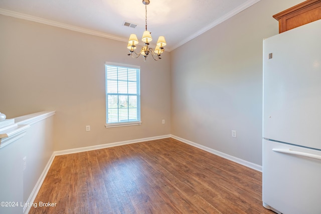 unfurnished dining area with a notable chandelier, dark hardwood / wood-style flooring, and crown molding