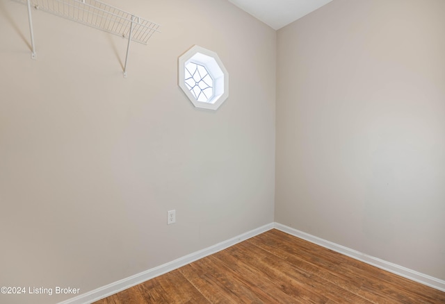 unfurnished room with hardwood / wood-style flooring