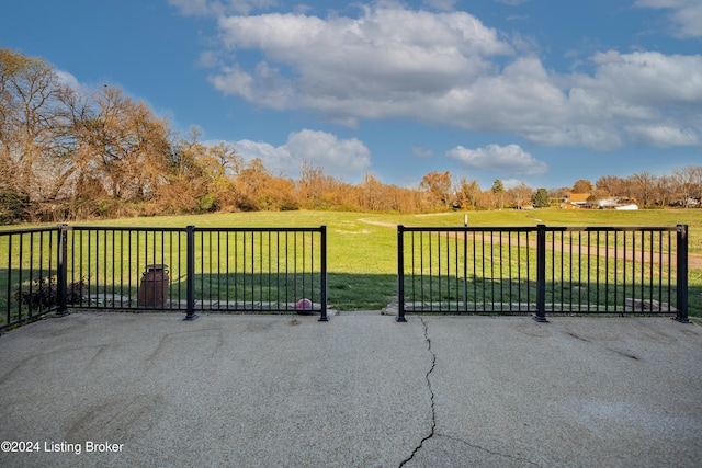 view of gate featuring a yard