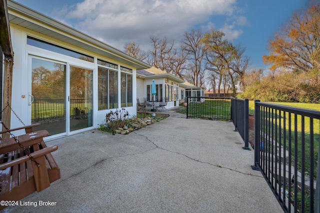 view of patio with a sunroom