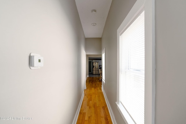 hallway with wood-type flooring