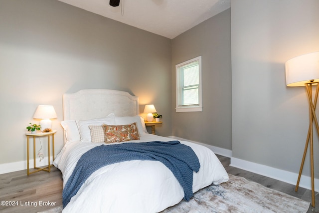 bedroom featuring hardwood / wood-style flooring and ceiling fan