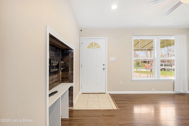 foyer with light wood-type flooring and ceiling fan