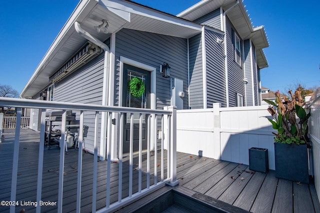 view of property exterior featuring a wooden deck