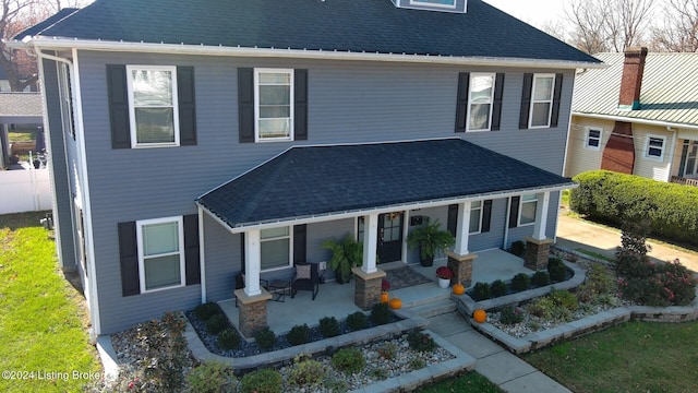 view of property with covered porch