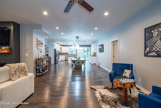 interior space with ceiling fan and dark wood-type flooring