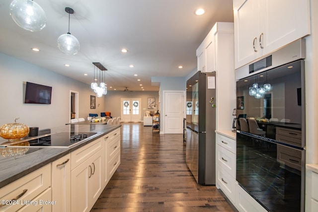 kitchen with french doors, dark hardwood / wood-style floors, pendant lighting, black electric stovetop, and white cabinets