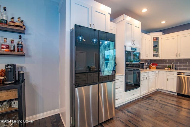 kitchen featuring dishwasher, dark hardwood / wood-style flooring, white cabinets, and black double oven