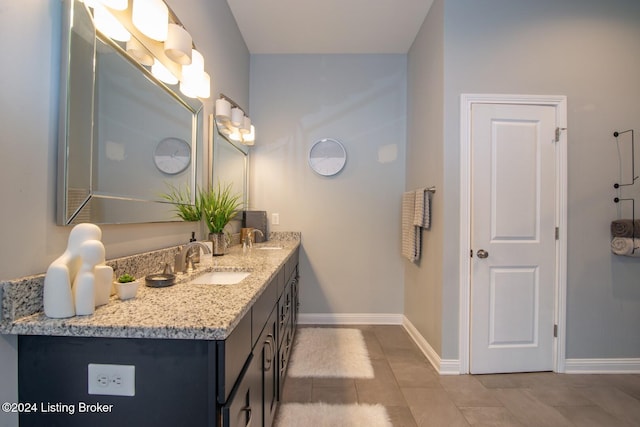 bathroom with tile patterned flooring and vanity