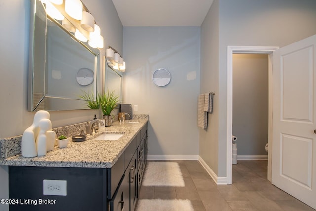 bathroom with tile patterned floors and vanity