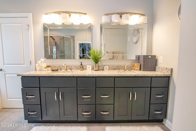 bathroom with vanity, tile patterned floors, and walk in shower