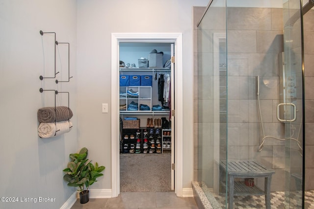 bathroom featuring tile patterned flooring and walk in shower