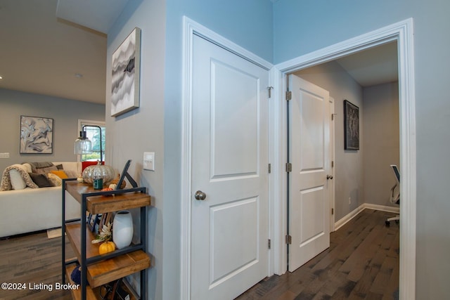 hallway with dark wood-type flooring