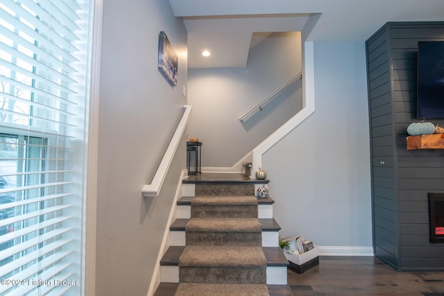 stairs with wood-type flooring