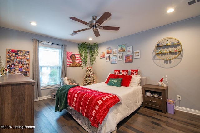 bedroom with ceiling fan and dark wood-type flooring