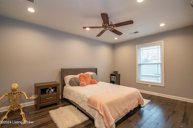 bedroom with ceiling fan and dark hardwood / wood-style flooring