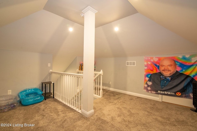 bonus room with carpet flooring and lofted ceiling