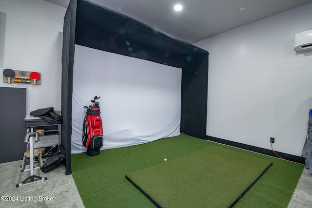 playroom featuring a wall unit AC and golf simulator