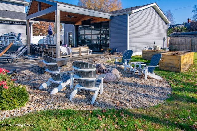 exterior space featuring ceiling fan