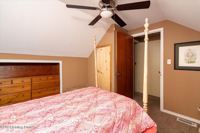 bedroom with dark colored carpet, vaulted ceiling, and ceiling fan