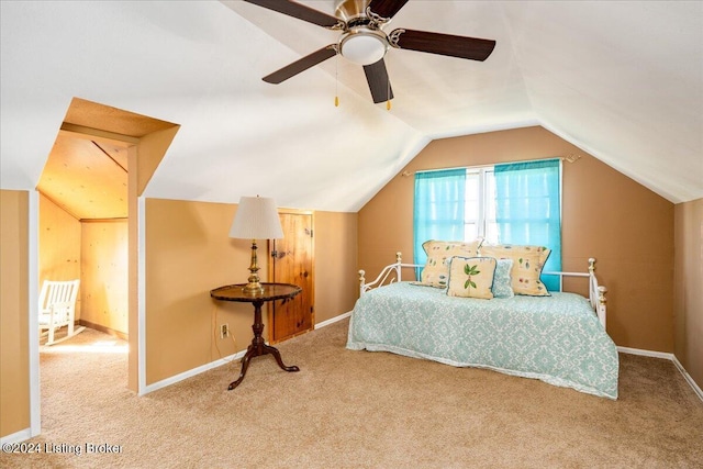 carpeted bedroom featuring ceiling fan and vaulted ceiling