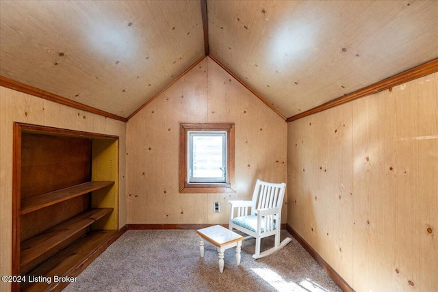 unfurnished room featuring carpet, wood ceiling, lofted ceiling, and ornamental molding