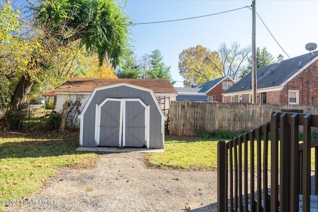 view of outbuilding featuring a yard