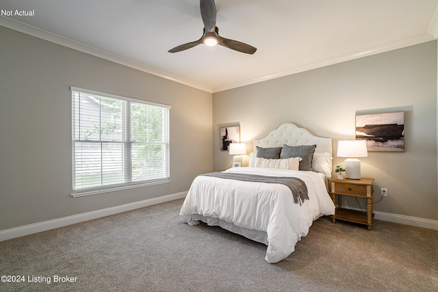 carpeted bedroom featuring ceiling fan and ornamental molding