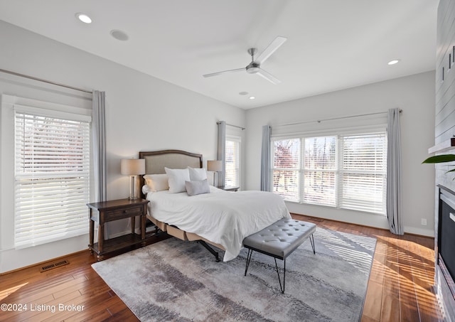 bedroom with ceiling fan and hardwood / wood-style flooring