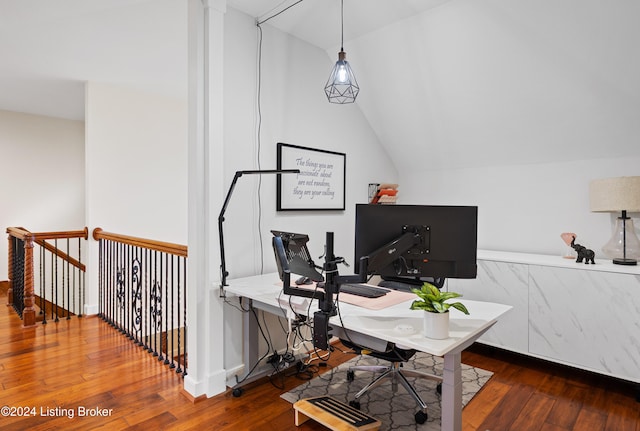 home office featuring lofted ceiling and hardwood / wood-style flooring